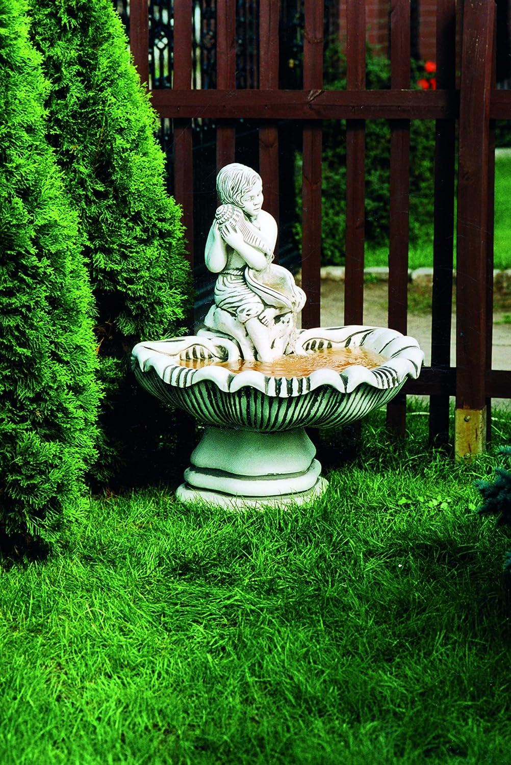 Boy in Seashell Water Fountain