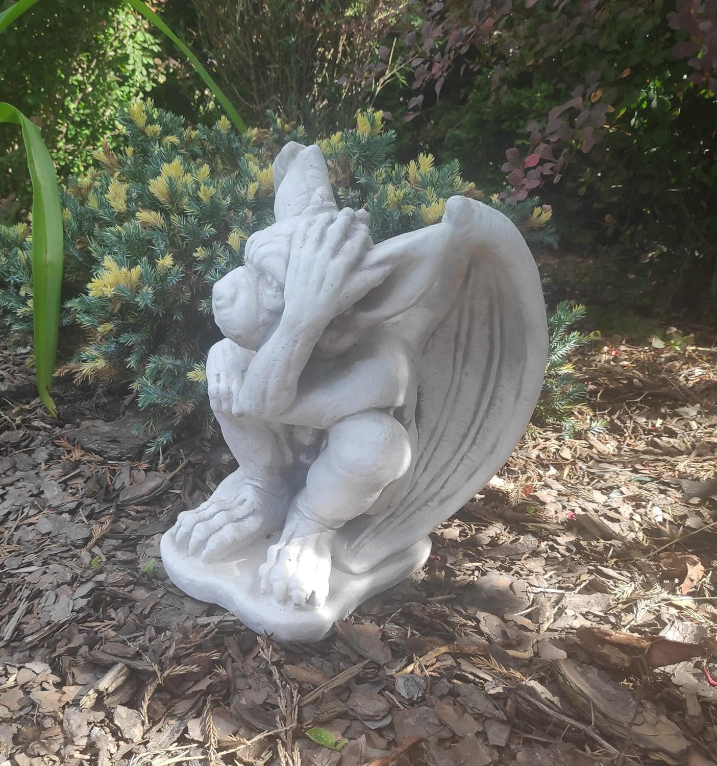 Small figurine of gargoyle, outdoor or indoor ornament, stone statue