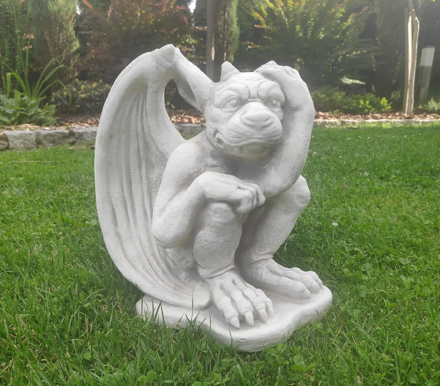 Small figurine of gargoyle, outdoor or indoor ornament, stone statue